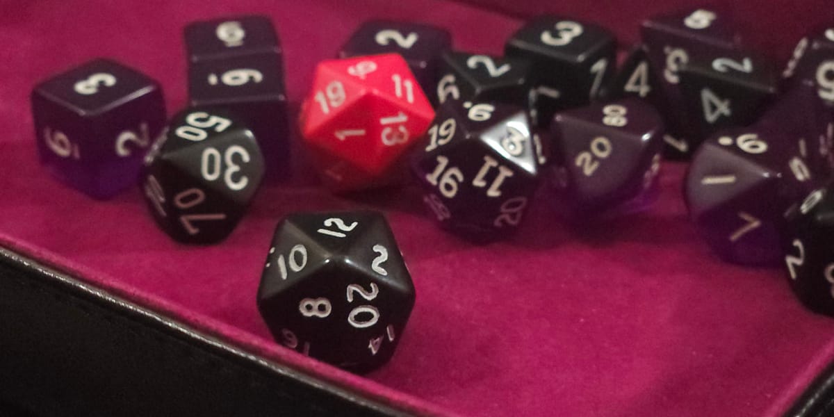 some dice in a purple dice tray
