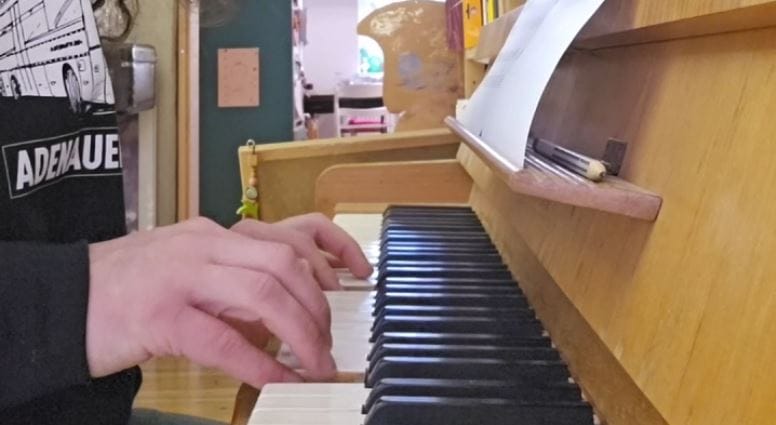 Jacob's hands on a piano